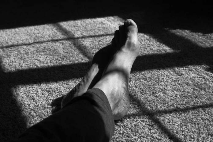Black & White photo of an old man's feet