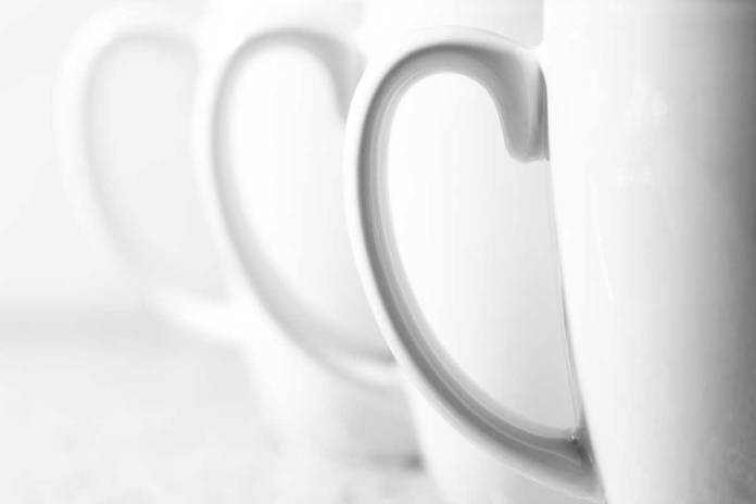Close-up photograph of three coffee mugs in-line.